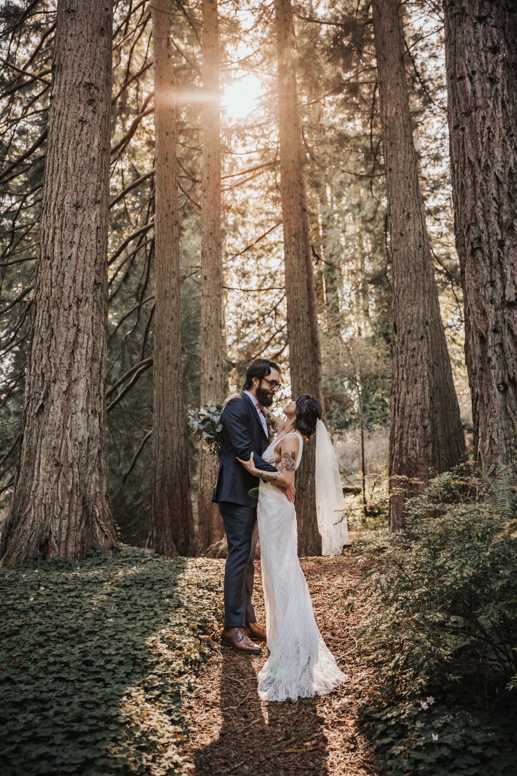 bride and groom in woods