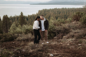 Golden sunrise light glows behind a couple during their Lake Tahoe engagement session