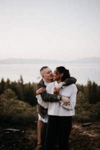 Windblown and glowing—Lake Tahoe engagement photos at sunrise with a dreamy golden sky