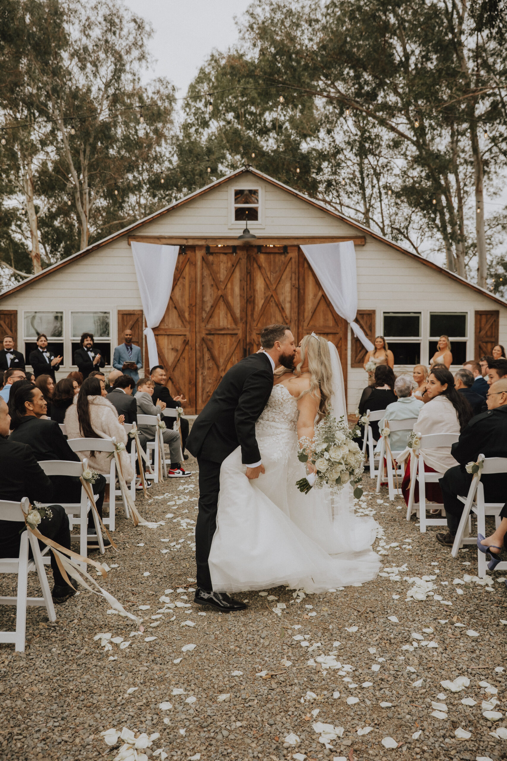 bride and groom kissing at gladding farms wedding